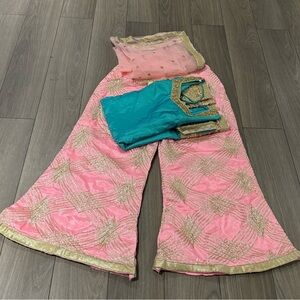 Vibrant Pink and Teal Ensemble with Gold Details